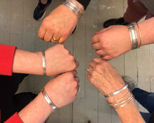 Load image into Gallery viewer, Silver Bangles | December 2 + 9&lt;br&gt;In addition to soldering, students will learn a variety of techniques to change the surface, color, and texture of their bangles...
