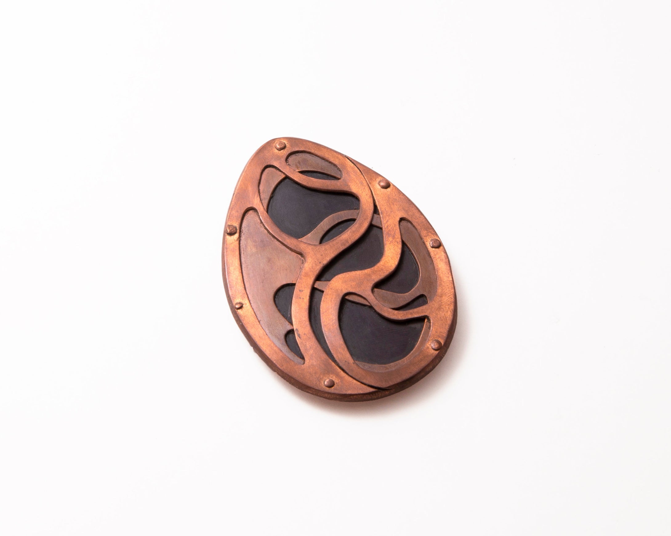 Intro to Riveting: Silver Pendant with Wood | March 3, 10, 17 <br> Riveting is a process where two or more pieces of metal or non-metal materials are connected without heat...